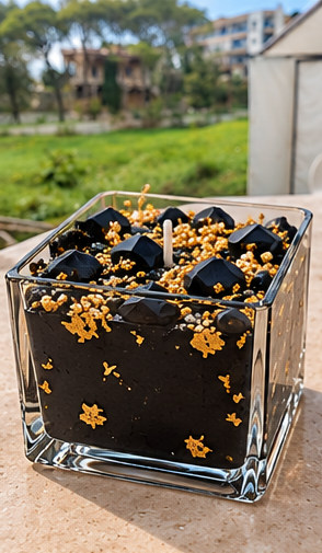 Midnight Gold decorative premium soy wax candle in a square glass cup